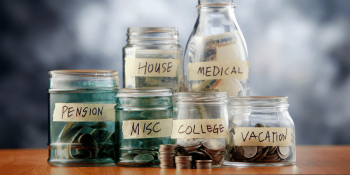 Jars of money with budget categories labelled